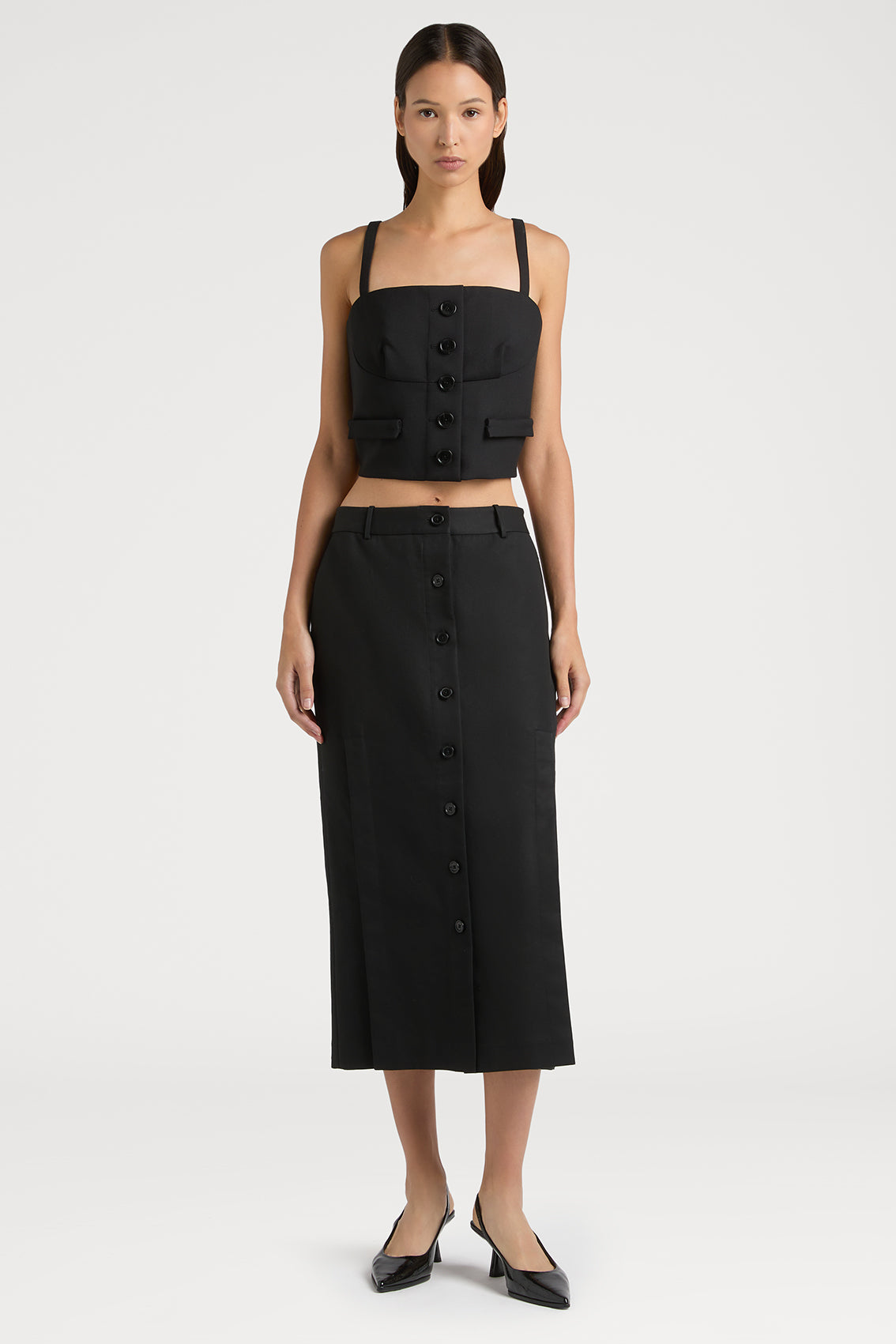 REFINED SKIRT SHOWCASING STYLISH CUT-OUT DETAILS AND BUTTON FEATURES